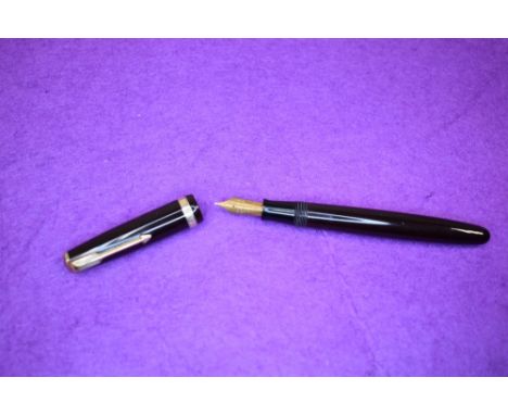 A Parker Duofold button fill fountain pen in chocolate with a single broad decorated band to cap having a Parker Duofold N ni