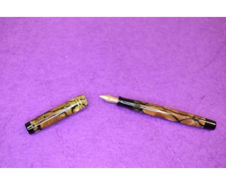 A Parker Moderne Jnr (probably) fountain pen in brown onyx, two narrow bands to the cap, button fill. With a Parker Canada 14