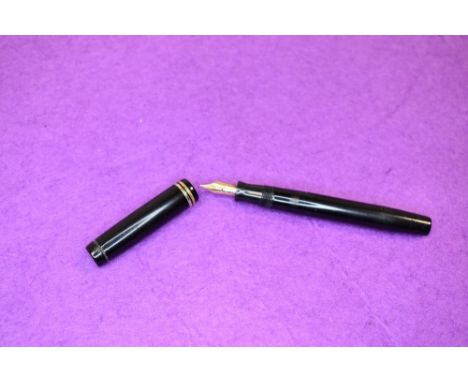 A Parker Duofold in black. With two narrow rings to cap, button fill, Parker Duofold nib. Approx 12.2cm no clip