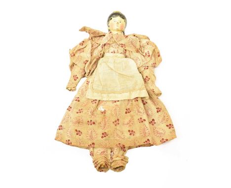 Circa 1830 Grodnertal Doll with black painted curled hair with hair comb, painted face, pierced ears and earrings, on a joint
