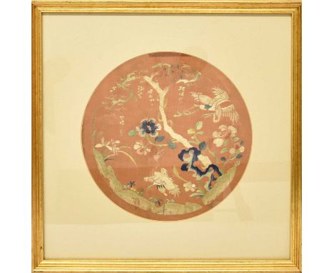 Late 19th/Early 20th Century Chinese Embroidery of a dragon on a red silk ground, taken from a robe, mounted and unframed, 37
