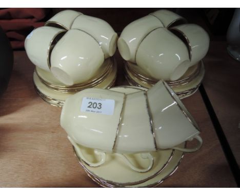 A William Hulme part tea service in cream and gilt