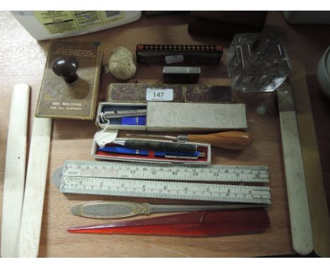 A miscellaneous lot including letter openers, tri-coloured propelling pencil and leads, and a Case del Soehne harmonica etc