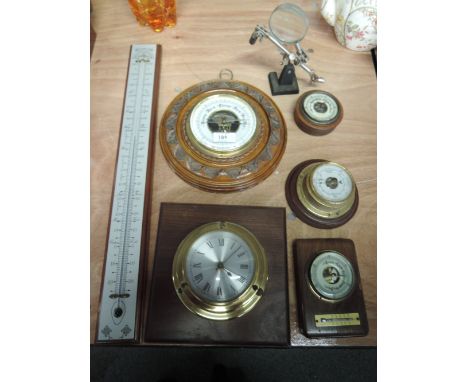 Four barometers, a wall mounted clock and thermometer etc