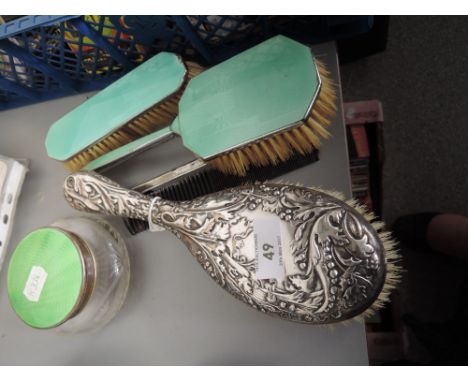 Three enamel and glass table pieces and a silver dressing table brush having raised leaf and berry embossed decoration, Birmi