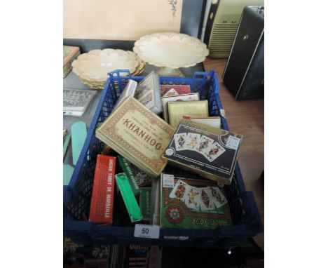 A tray of various playing cards and card games
