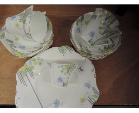 An Art Deco style part tea service with blue, green and yellow decoration (23 pieces approx)