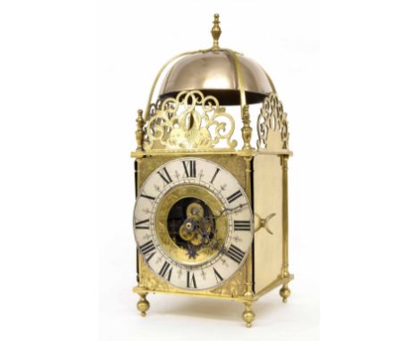 Eureka Cromwellian electric brass lantern clock, the 7" silvered chapter ring enclosing a brass plate inscribed Eureka Clock 