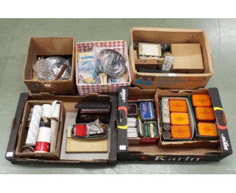 Large quantity of nuts, bolts and other fixings; also a quantity of small clock accessories including winding keys and tools 