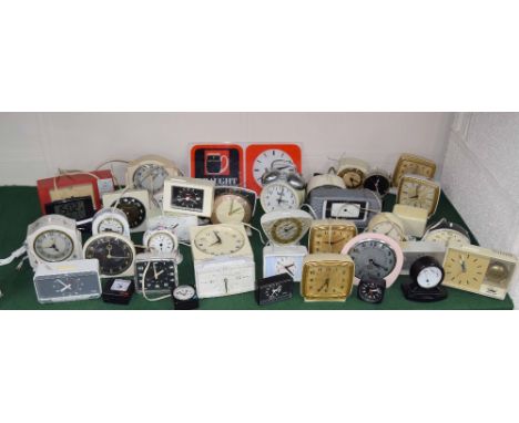 Very large quantity of contemporary mainly plastic and pottery cased small mantel and alarm clocks (over twenty-five)