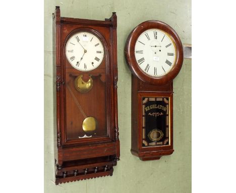 American regulator wall clock, the 8" cream dial within a glazed pillared case with lower gallery, 36" high (pendulum); also 