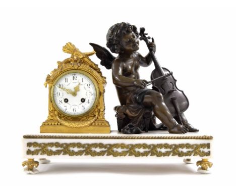 French gilt metal and bronzed figural two train mantel clock, the S. Marti movement striking on a bell, the 3.75" white dial 