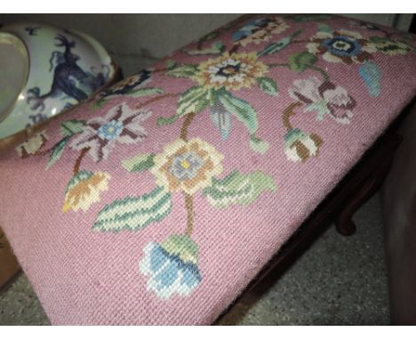A tapestry covered kneeling stool