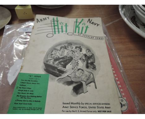A selection of vintage sheet music including 'Army Navy Hip Kit of Popular Songs' issued monthly by US army