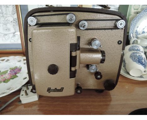 A Specto 8 super eight film projector. Wiring removed sold as decorative only.