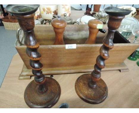 A selection of treen including a pair of twist stem candlesticks and a planter etc