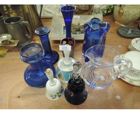 A selection of blue glass, a Caithness Jug ceramic bells etc