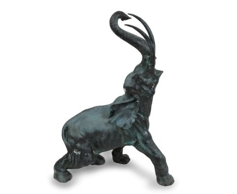 Patinated bronze elephant with raised trunk, h. cm. 90x65