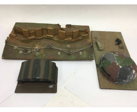 A modern army recruitment office, air hanger, pill box and trench play set.