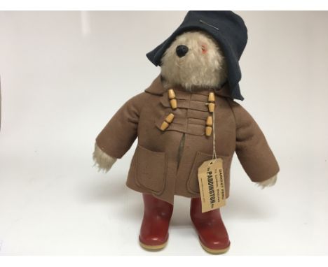 A vintage Paddington Bear with original signed ticket