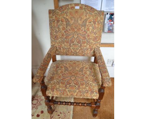 A pair of Jacobethan bobbin framed armchairs in patterned chenille upholstery