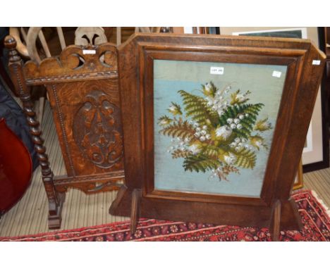An oak framed fire-screen inset needle and bead-work panel with another example