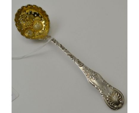 Possibly John McKell, a Scottish William IV silver sifting ladle, with embossed gilded bowl, and scallop fiddle handle, Glasg