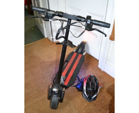 An RoHS electric scooter - model ES - N3 -  off road 10" wheels 45km top speed, with charger and a safety helmet FULLY WORKIN