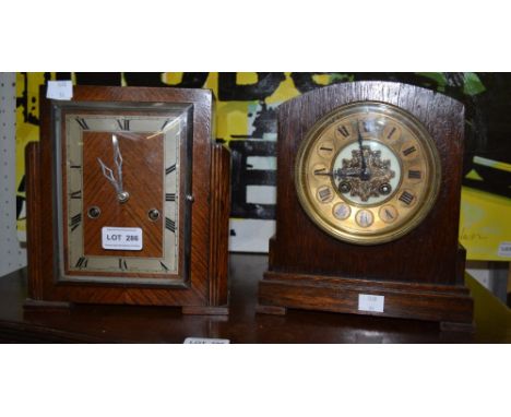 An Art Deco design mantle clock together with another example