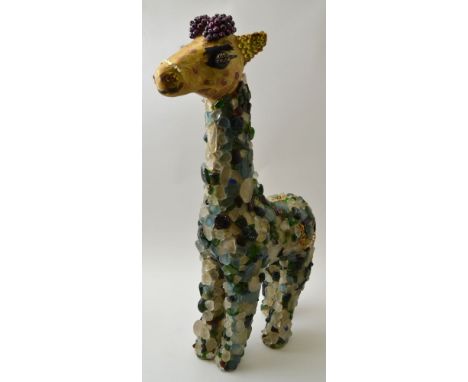 A unique Studio Art Giraffe, decorated with sea glass gathered from the beach at Charmouth Dorset, 56cm high , Condition is g