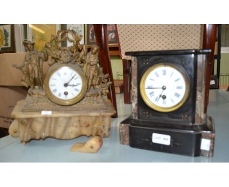 A black slate mantle clock an onyx and gilt metal example in need of repair