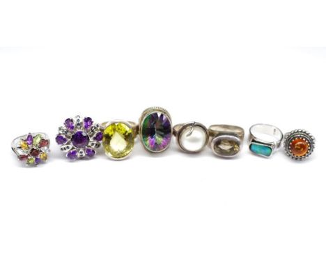 Eight gemstone and silver rings includes mystic topaz, lemon quartz, smoky quartz, opal triplet, mabe pearls set pieces. Appr