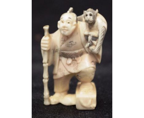 Japanese carved ivory netsuke standing figure of a man with monkey on his shoulder, signed to base, (height 5cm approx). NOTE