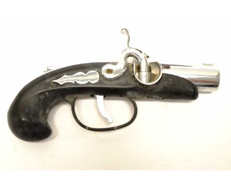 Vintage novelty lighter in the form of a gun fitted on a timber stand