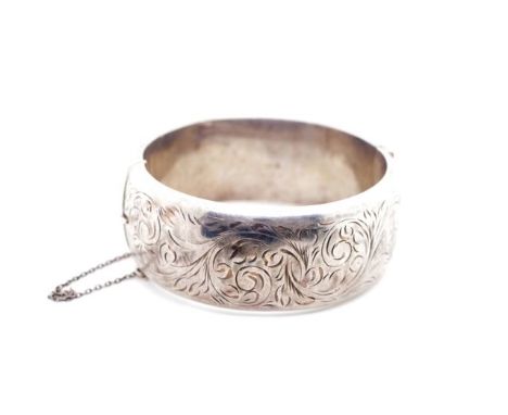 Sterling silver hinged bangle marked Chester 1957 S&amp;E. Approx inside width 60mm, bruises to the body