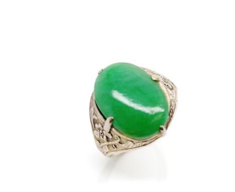 Vintage Oriental jade and silver ring with floral repousse decorated shoulders, marked Oriental marks to shank. Approx jade s