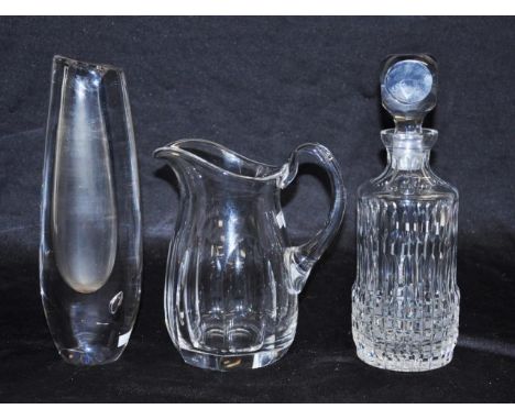 A good Orrefors cut crystal water jug height 19cm approx., together with a Kosta art glass vase &amp; a cut crystal decanter