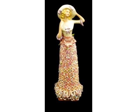 Vintage ceramic half doll with beaded robe on wood stand, (height 21cm approx, total).