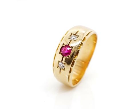 Diamond and ruby set yellow gold ring Unmarked. With feather edge banding Approx 1x round cut ruby 3.25mm dia. 2x round cut d