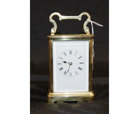 A good brass carriage clock with roman numerals to enamel dial, half hour and hour striker, key available, appears operationa