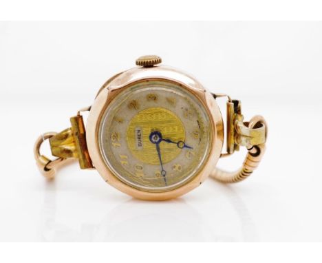 George V 9ct rose gold wrist watch marked London 1928 LA to case, Buren to manual wind mechanism and dial. On a gilt metal br