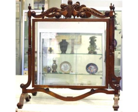 Vintage toilet mirror with carved header and supports. 75cm wide and 80cm tall.
