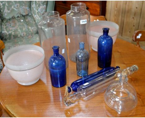 Glassware - a Victorian blue glass rolling pin; a fly trap; blue glass chemist bottles; a pair of clear glass pontilled jars;