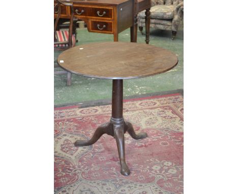A George III oak tripod tilt-top table, circular top, canon barrel column, cabriole legs, pad feet, circa 1800. 72.5cm high x