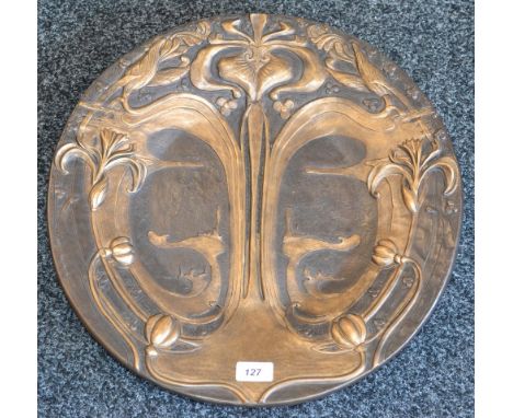 A reproduction Art Nouveau V&A Museum collection bronzed circular charger, moulded in relief with flowering lily stems amidst