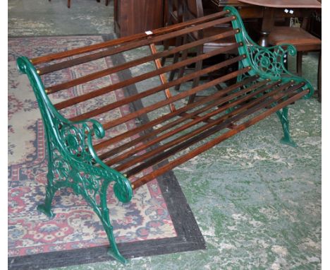 A decorative garden bench, cast metal ends.