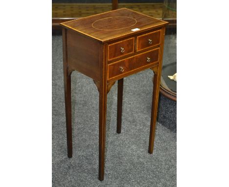 An Edwardian mahogany side cabinet, rectangular top, two short drawers over one long, axe head handles, tapering square legs.