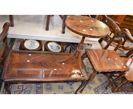 A walnut coffee shaped coffee table, glass topped; a walnut side table, shaped glass top; a reproduction mahogany wine table 