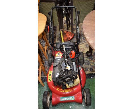 A Diamond 55 petrol lawnmoter, Briggs and Straton motor engine and a Stihl petrol strimmer