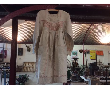A rustic jute smock with hand smoked detail and patch pockets